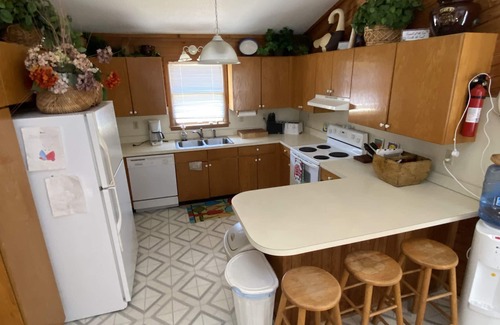 Carova Beach Casa | 2 Free beach parking passes! Waterfront Hot Tub Boat dock Pet friendly 360 Decks