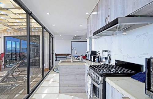 El Sargento Casa | 3 bedroom, 3 bath premium stylish shipping container home. Game room w/ darts, shuffleboard, video game cabinet, Infinity game table, new 8 person hot tub, multiple decks w/ firepits, fast Wifi ( 250 mb+)w/ Starlink backup. Free use of two SUPs.