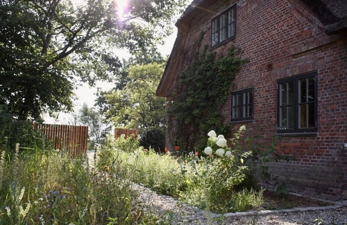 Rodenas Casa | 5* thatched roof house Ziegelmacher Achten 6600sqm natural garden with pond and outdoor sauna