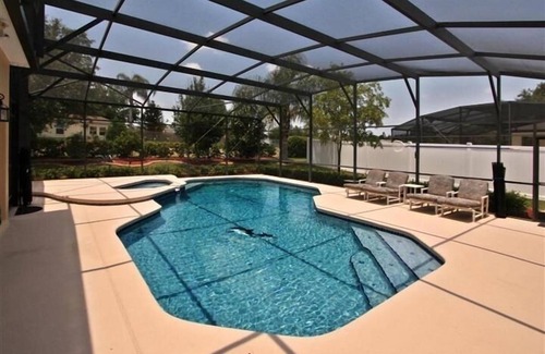 Grand Reserve Villa | Villa ejecutiva de 5 dormitorios, piscina grande, comunidad cerrada en Championsgate cerca de Disney