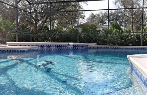 Grand Reserve Villa | Villa ejecutiva de 5 dormitorios, piscina grande, comunidad cerrada en Championsgate cerca de Disney