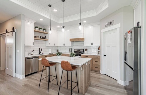 Idaho Falls Casa | 6 bed 3 bath home ~ sleeps 20! w/ game room, fireplace, hot tub & playground.