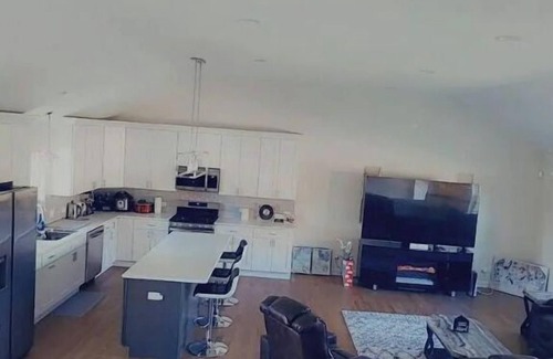 Oak Lawn Casa | A cozy bedroom in a home with high-tech amenities