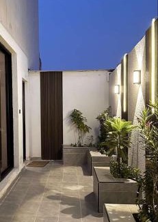 Al Hofuf Apartamento | A cozy two-bedroom apartment with a living room and a patio that inspires relaxation