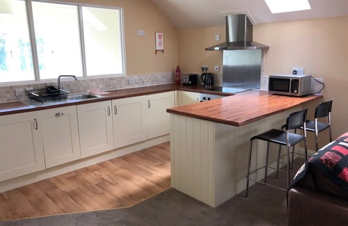 Freethorpe Apartamento | Un amplio loft con jardín en el pequeño pueblo de Freethorpe.