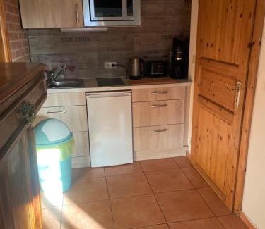 Hemmoor Apartamento | Altes Landhaus Oste, Klavier Appartement, 2 Zimmer mit Kamin