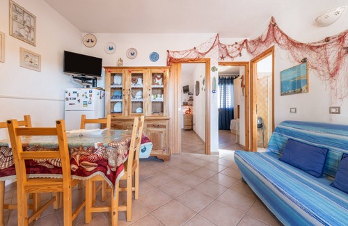 Buggerru Apartamento | Apartamento 'Adriana's House' con vistas al mar, terraza privada y aire acondicionado.