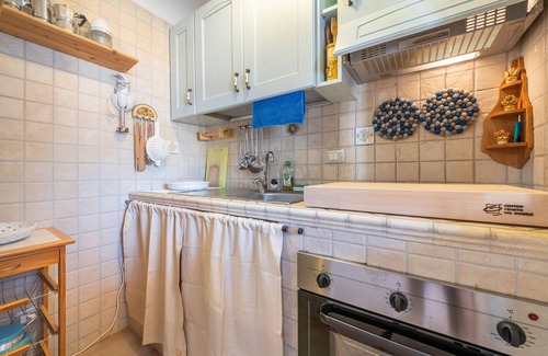 Buggerru Apartamento | Apartamento 'Adriana's House' con vistas al mar, terraza privada y aire acondicionado.