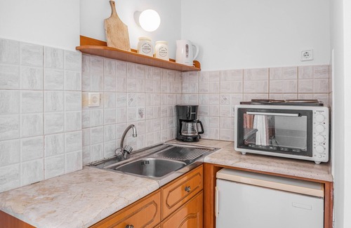 Kamari Apartamento | Apartamento 'Amphitrite -' con vistas al mar, Wi-Fi y aire acondicionado