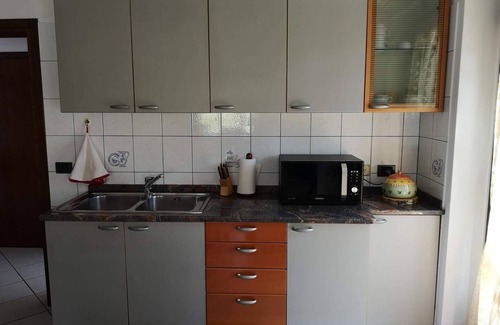 Croveo Apartamento | Apartamento 'Il Glicine' con jardín compartido