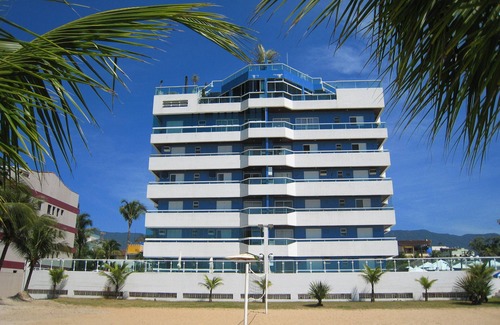 Bertioga Apartamento | Apartamento con garaje, vista al mar y directo asado para piscina y mar