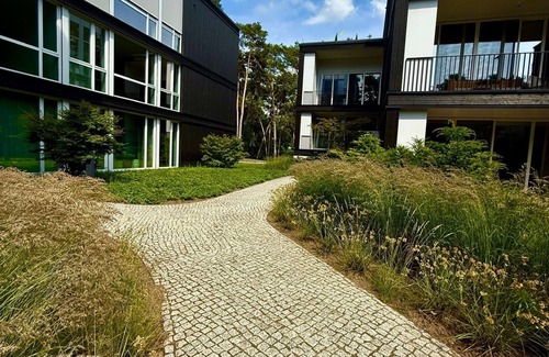 Bad Saarow Apartamento | Bad Seerose, cozy vacation apartment with lake view, roof terrace, pool and sauna