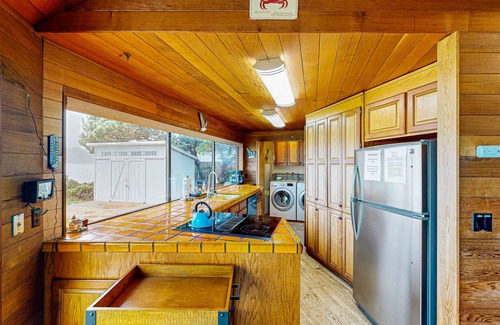 Bayshore Casa | Casa frente a la bahía con piscina compartida y acceso a tenis, cerca de la ciudad y las playas.