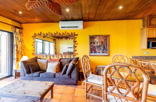Playa Flamingo Condominio | Beachfront Condo with Warm, Rustic Interiors & Direct Access to Playa Flamingo