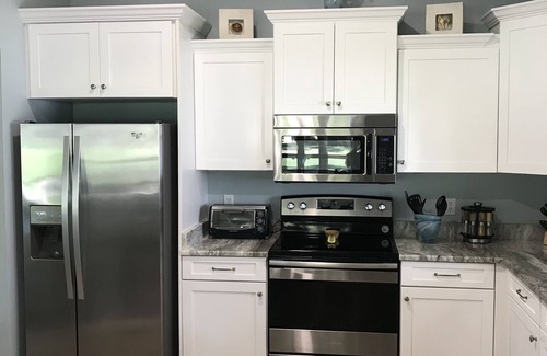 The Villages Casa | Magníficas vistas al campo de golf desde la piscina privada climatizada.