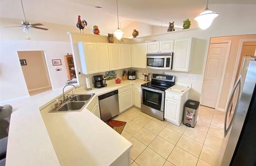 Sunridge Woods Casa | Beautiful waterfront home with heated pool and game room.