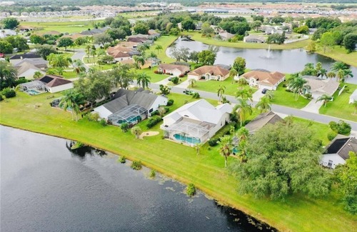 Sunridge Woods Casa | Beautiful waterfront home with heated pool and game room.