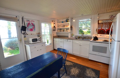 Spruce Head Cabaña | Berry Cottage, private dock, overlooking a sandy beach and bustling harbor