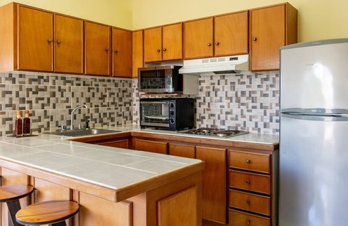 Playa Flamingo Condominio | Birds-eye Ocean View in Nicely Priced Top-floor Unit in Flamingo