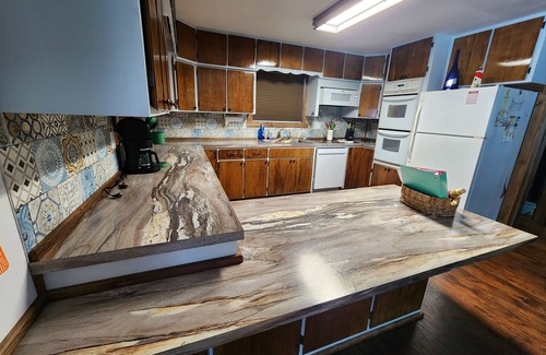 Edmore Casa | Blue Heron Point: Hot Tub, Fireplace, Lakefront, King Bed!