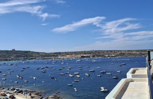 Għadira Apartamento | Bright Coastal Penthouse with Huge Terrace Overlooking the Sea- Ghadira Mellieha