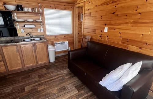 Dickerson Run Cabina | Cabin 4 - Stay like royalty. Sit on your concrete patio overlooking the beautiful Youghiogheny River.
