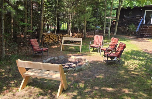 Eagle River Casa | Cabin on Voyageur Lake–2BR Retreat on ER Chain w/ Deck, Firepit & Sandy Beach!