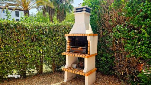 Costa Esuri Apartamento | (CAP001) Con jardín y acceso a la piscina.