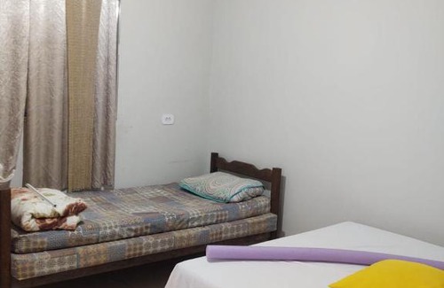 Ilha Comprida Casa | Casa amarela cantinho de lazer