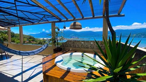 Praia Grande Casa | Casa de praia com vista para o mar