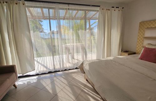 Monitos Casa | Casa Suite Palmar del viento FRENTE, FRENTE AL MAR by Amauna