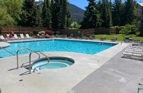 Village North Hotel | Cascade Lodge suite with 2 hot tubs pool gym sauna cable TV Wi-Fi