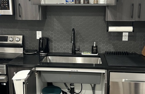 Calgary Casa | Charming 1-Bedroom Basement Walkout Suite with a Gym and Office.