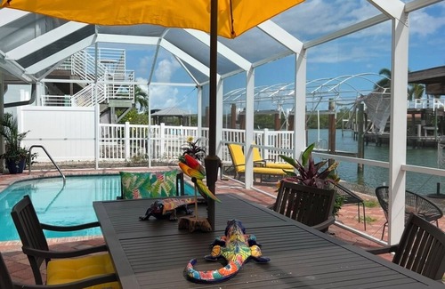 Isles of Capri Casa | Charming 2-bedroom house with Pool and Boat Dock on canal. Bring or rent a boat