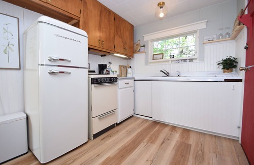 Webster Cabaña | Charming Lakeside Cottage nestled on 40 private, wooded acres on Big Sand Lake