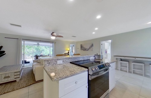 Fort Myers Casa | Charming waterfront home with firepit, central AC, hot tub, W/D, & dog-friendly