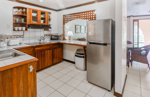 Damas Condominio | Clean & Bright Getaway W/ Shared Pool, Lush Gardens, & Ideal Location Near Town!