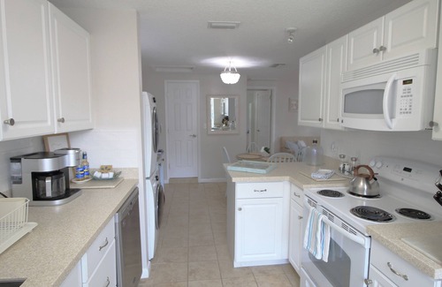 Dunedin Casa | Centro costero Dunedin Inicio con bicicletas y carrito de golf