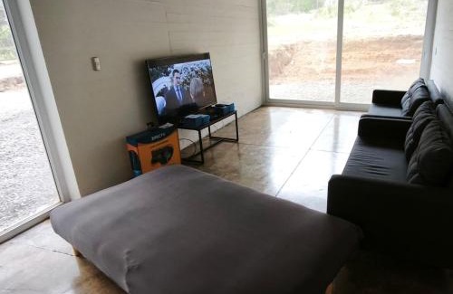 Tunquen Casa | Concrete house overlooking the ocean and beach access