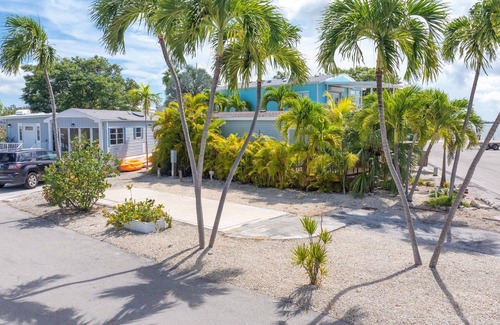 Cudjoe Key Alquiler De RV | Corner RV Lot with Lagoon Views, Palm Trees, and Steps to Pool & Amenities