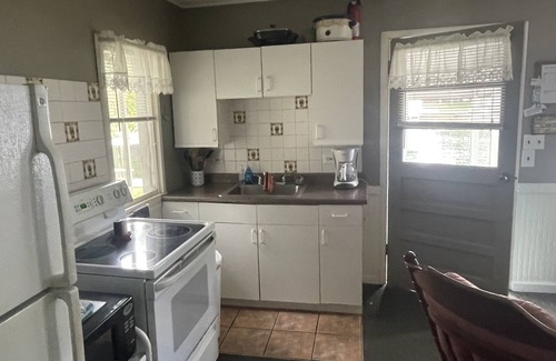 Ludington Cabaña | Cottage 2 is a 2 bedroom 25’ from its boat dock & Hamlin Lake