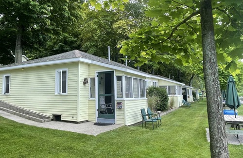 Ludington Cabaña | Cottage 2 is a 2 bedroom 25’ from its boat dock & Hamlin Lake