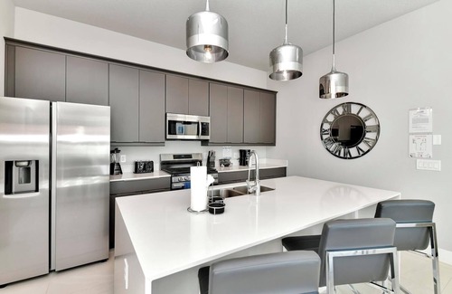 Reunion Hotel | Modern Condo with Large Outdoor Patio. Reunion Resort Water Park Access near Disney at Spectrum Resort Orlando by Rentyl – B9 #136