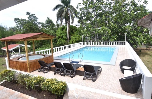 Mammee Bay Apartamento | Acogedora casa de campo, a 5 minutos a pie de la playa, hermoso jardín perfecto lugar de relajación