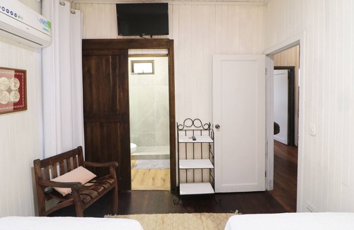 La Cruz Casa | Cozy hotel-style suite with private bathroom, on-site dining, & fast WiFi