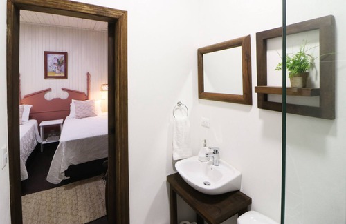 La Cruz Casa | Cozy hotel-style suite with private bathroom, on-site dining, & fast WiFi