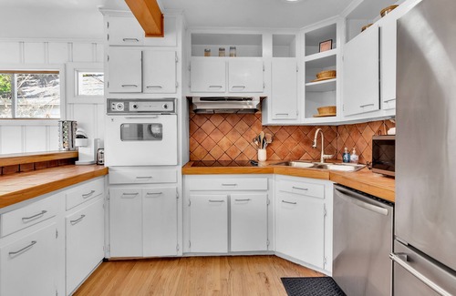Loring Heights Casa | Cozy Midtown retreat with skyline views, private yard, deck, firepit, & W/D