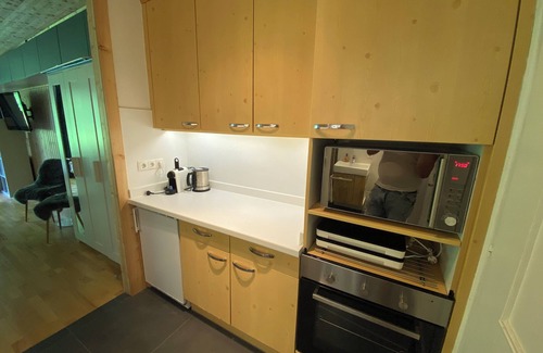 Sankt Martin bei Lofer Apartamento | Cozy new vacation apartment with mountain views, garden and swimming pool