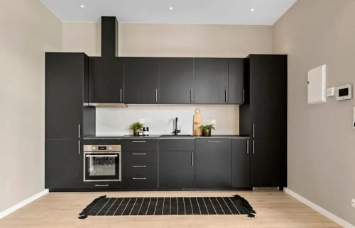 Larvik Apartamento | Delikat, romslig og sjønær sentrumsleilighet