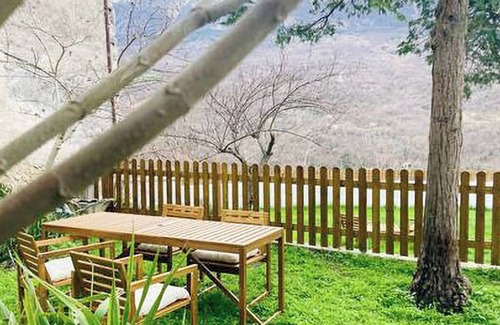 Caramanico Terme Casa | Designer home with artistic soul, a panoramic garden overlooking the mountains.